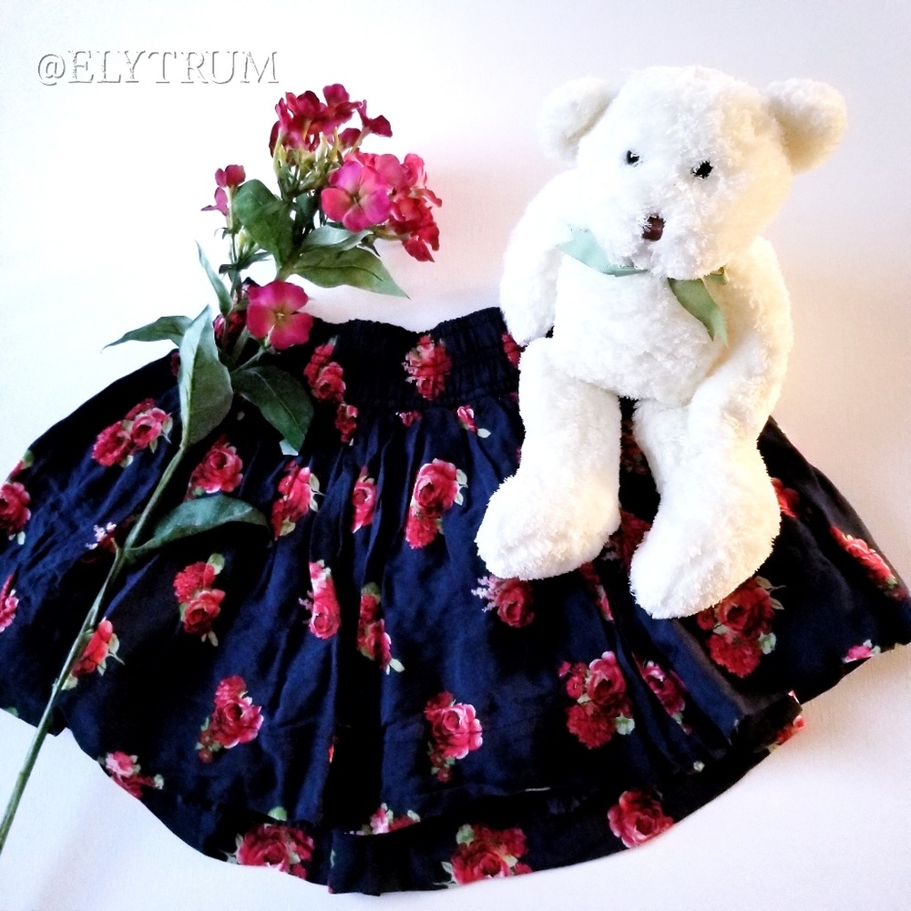 Abercrombie Kids dark blue floral stretchy skirt.